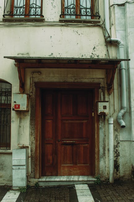 Traditional wooden door representing the heritage and foundation of Buyhughes